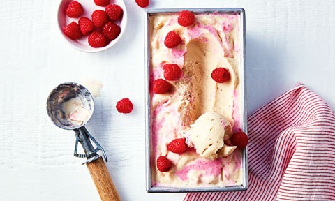 One scoop of banana and berry swirl frozen yoghurt, garnished with Coles fresh raspberries.