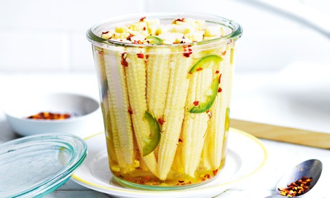 A cup of chilli pickled baby corn