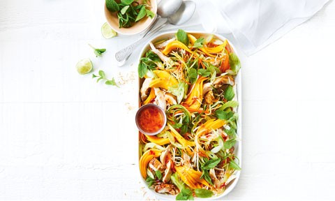 Asian-style chicken and mango salad with carrot, cucumber and bean sprouts