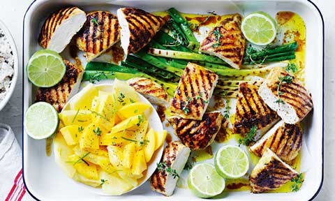 Jerk-style chicken chops with coconut rice and lime weges