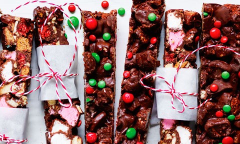 Several pieces of Christmas rocky road on a dish.
