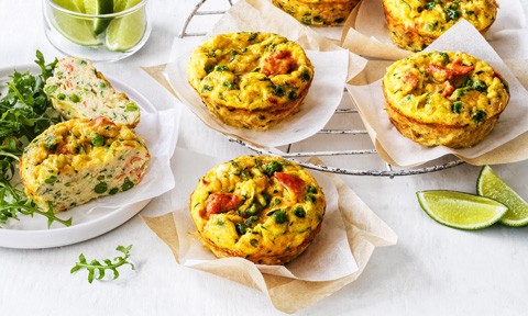 Five cheesy salmon frittatas on baking papers