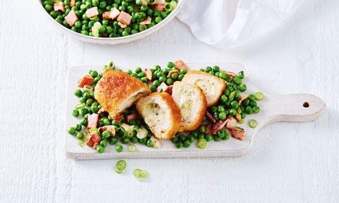 Chicken Kiev thickly sliced with pea salad