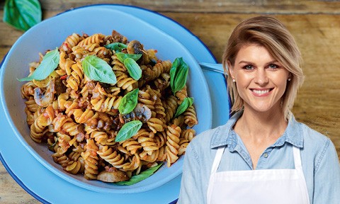 Courtney Roulston and her vegan bolognese tossed with pasta and basil on top