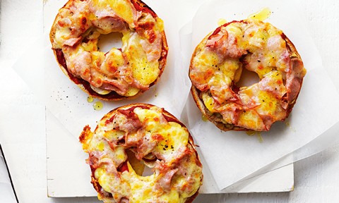 Three bagel pizzas with cheese and ham