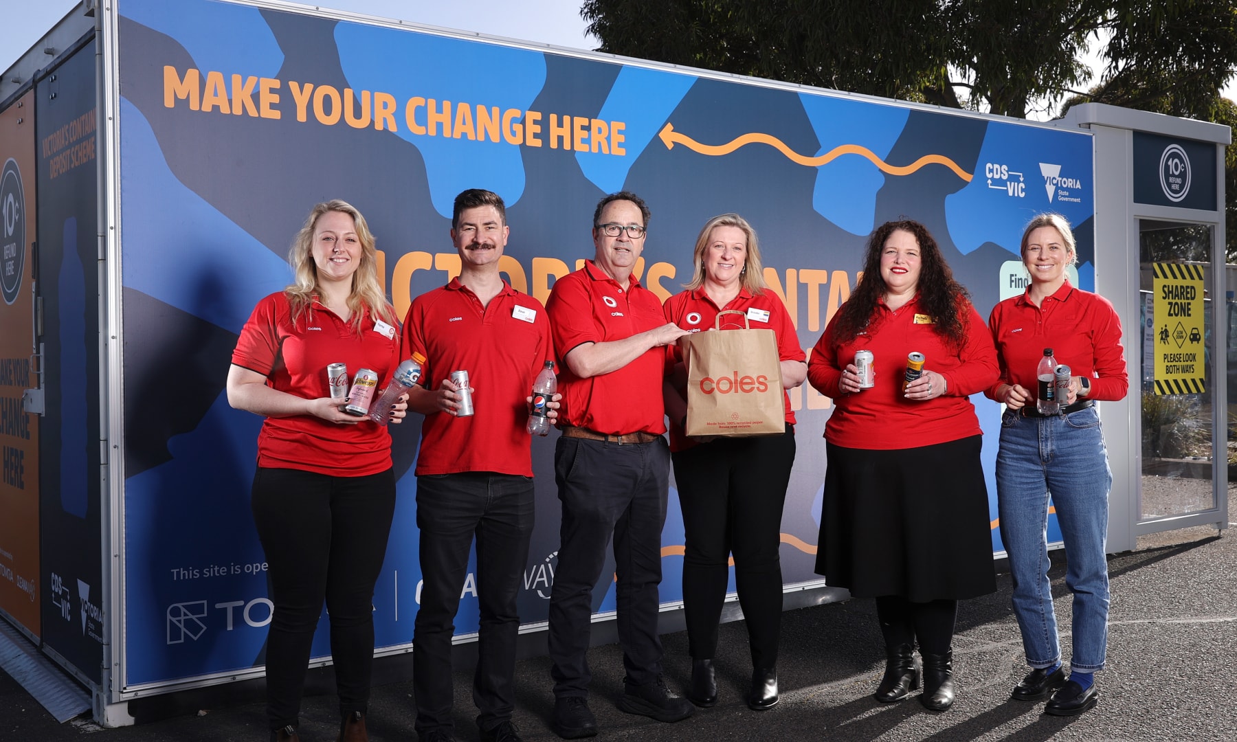 container deposit scheme team in front of truck