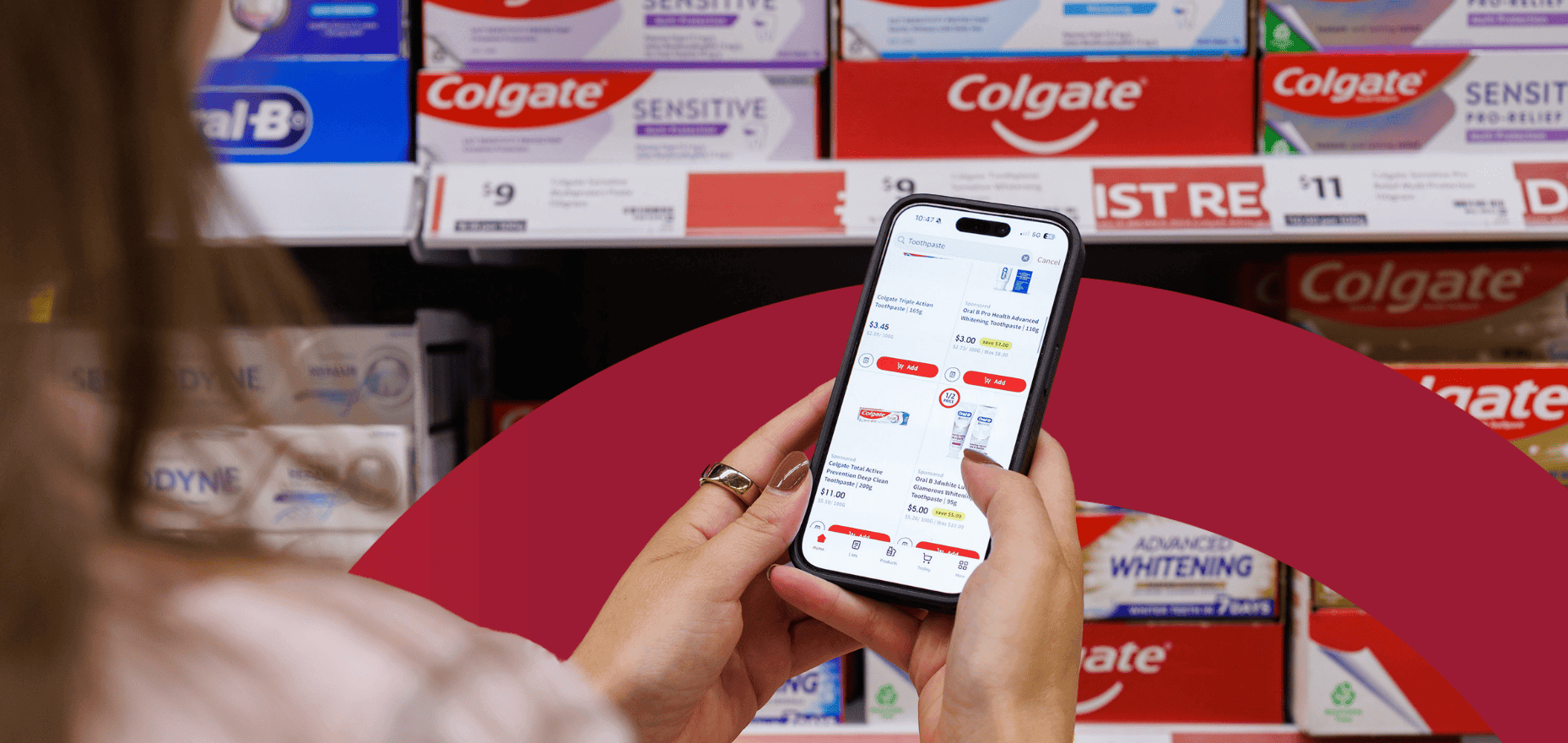 Coles app on phone in front of shelf