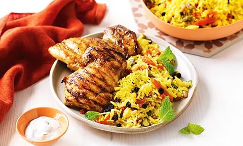 Barbecue chicken thighs with a Persian rice salad