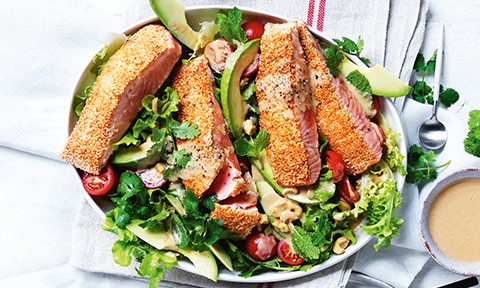 Sesame crusted miso salmon on a bed of veggie salad