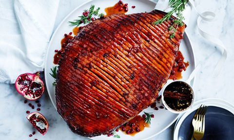 Pomegranate and cinnamon glazed ham with thyme sprigs