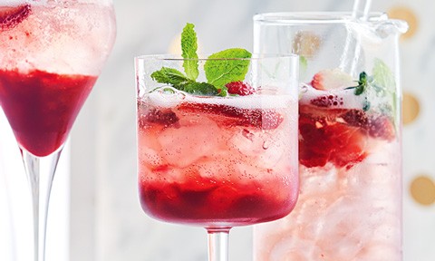 Three cups of raspberry and prosecco punch