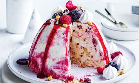 Raspberry nougat ice cream bombe topped with berries