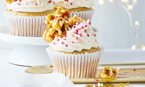 Three vegan cupcakes with caramel popcorn on top