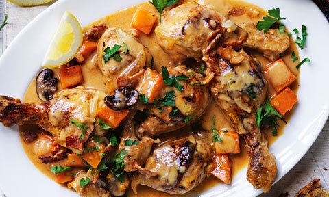 Creamy Chicken with Pumpkin and Mushrooms, garnished with lemon and flat leaf parsley