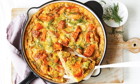 Salmon and Leek Frittata in pan, with a side of dill sprigs