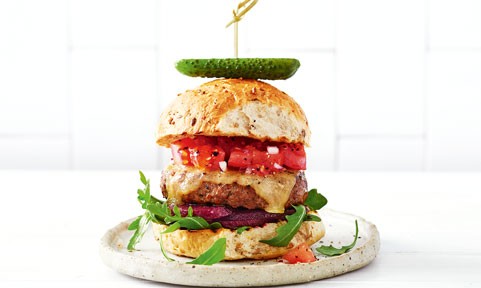 Beef burger with fresh tomato salsa and cucumber