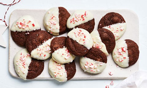 A tray of chocolate and candy cane cookies sprinkled with more crushed candy canes