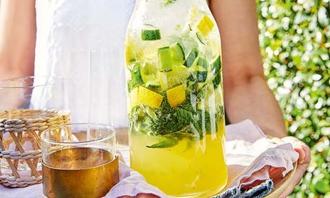 Cucumber, lime and basil spritz in a large jug