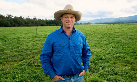 Beef farmer standing in paddock