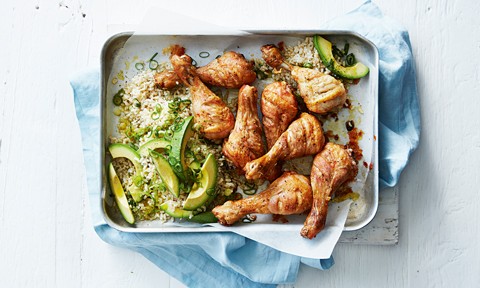 Curtis’ roast chicken drumsticks with avocado on top of rice, sprinkled with salt and pepper