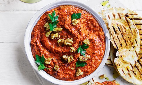 Charred capsicum dip topped with walnuts and parsley, served with grilled pita bread