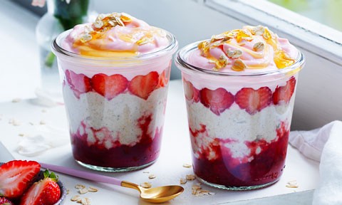 Two Glass Cups Full of Strawberry and Coconut Bircher Muesli