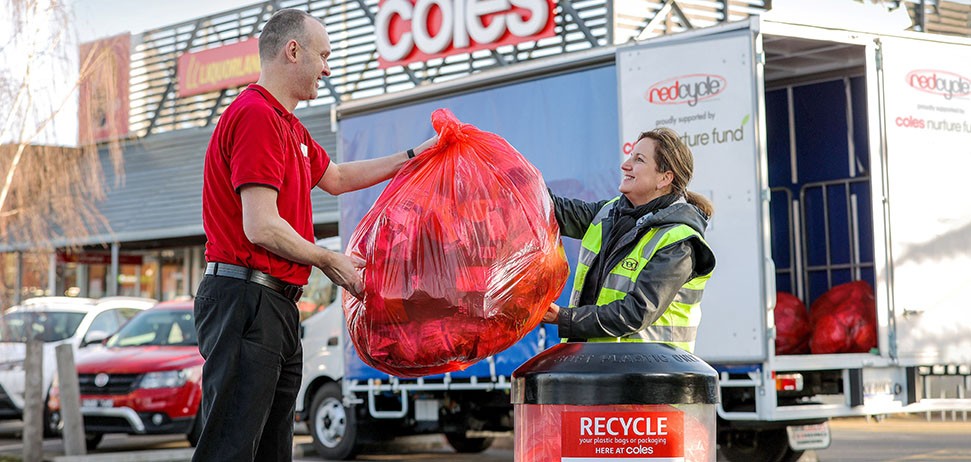 Coles employee at a REDcycle recycling bin