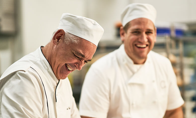 Laurent and Curtis Stone laughing