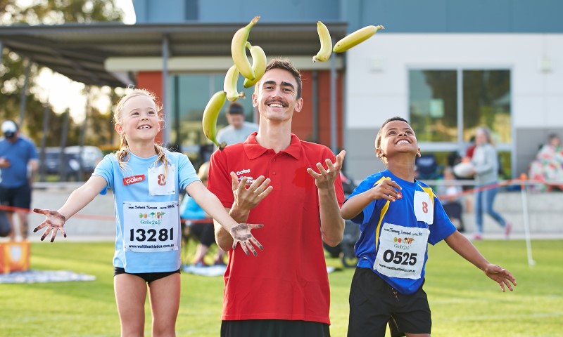 Brandon Starc with children from Little Athletics