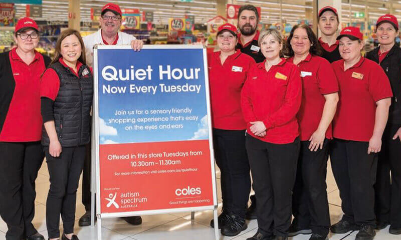 Coles team standing next to Quiet hour sign