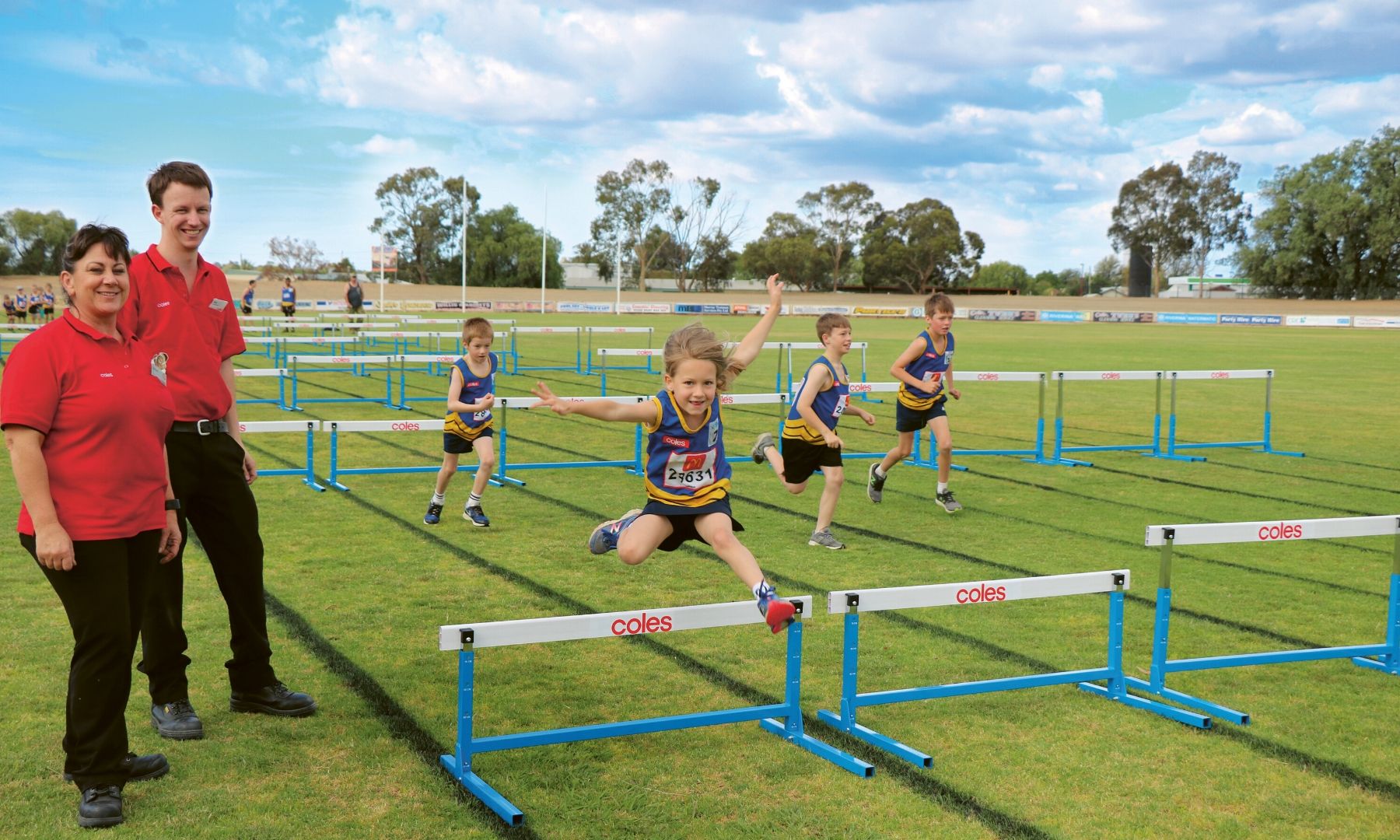 Children crossing hurdles on the playground