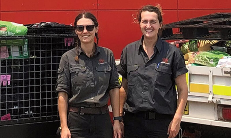 Mogo Wildlife Park employees standing next to ute filled with food donations