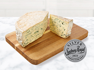 Coles Finest Australian Blue Vein on a chopping board on benchtop