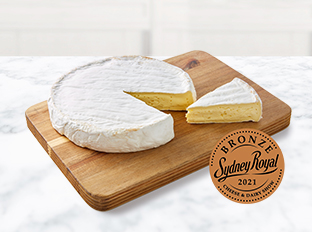 Coles Finest Australian Organic Double Cream Brie on chopping board
