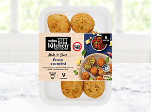 Coles Kitchen Pesto Arancini in packet on benchtop 