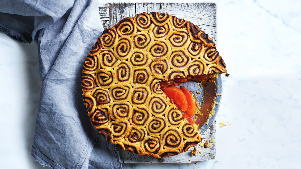 Apple Pie with Cinnamon Swirl Pastry on a blue tea towel