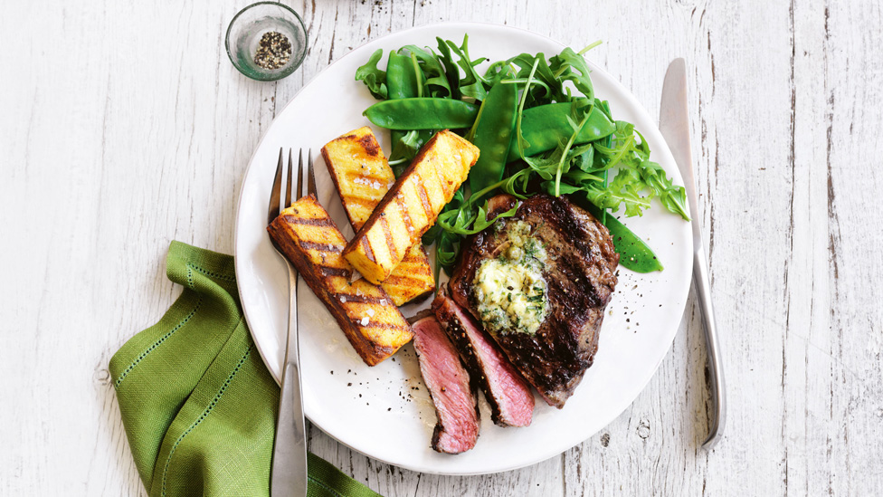 BBQ porterhouse steaks thickly sliced with caper-tarragon butter