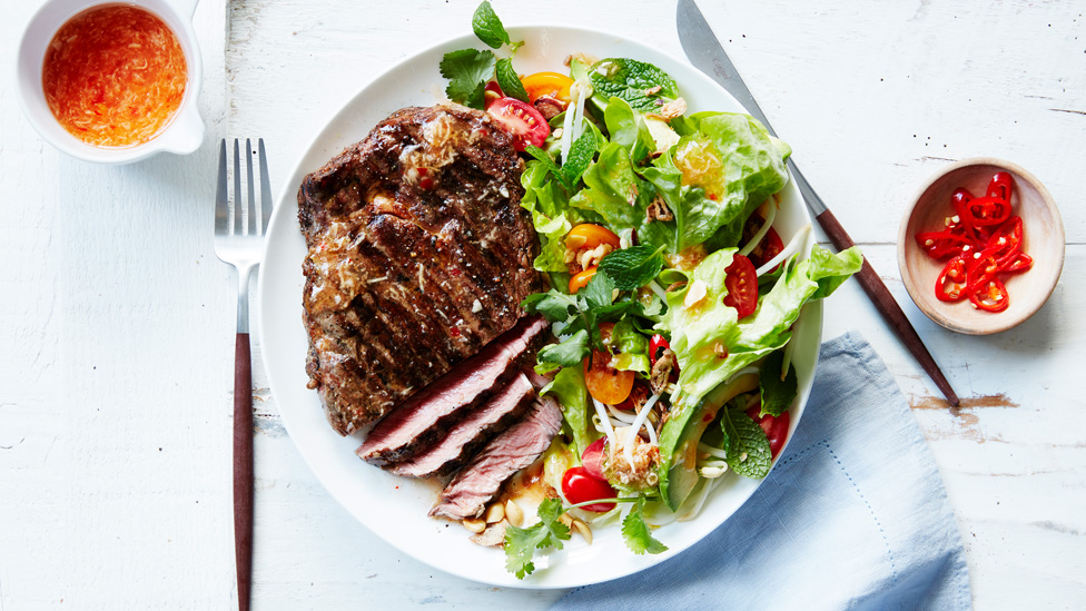 BBQ steaks with spring peanut salad and fried shallots