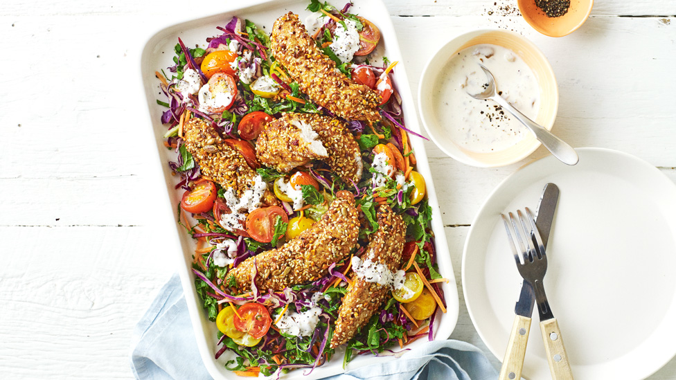 Dukkah Chicken baked in tray with salad, served with green olive dressing