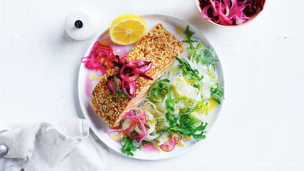 Dukkah salmon served with pickled beetroot, salad, and orange