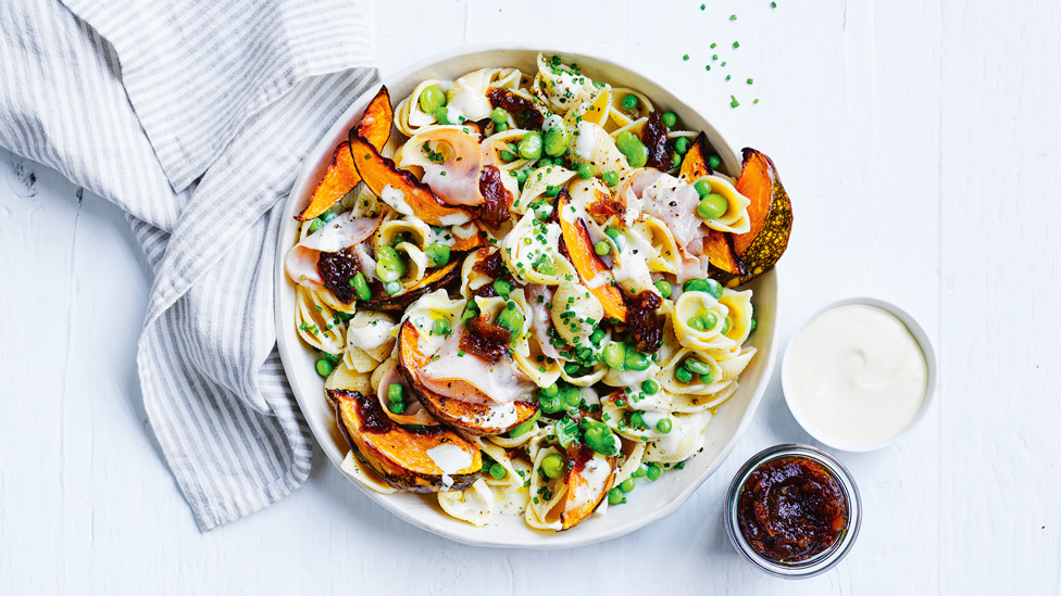 Pea and ham pasta salad with pumpkin mixture and onion jam