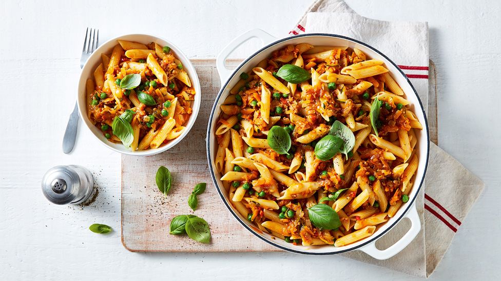 Mixed vegetable bolognese in a frying pan and a bowl