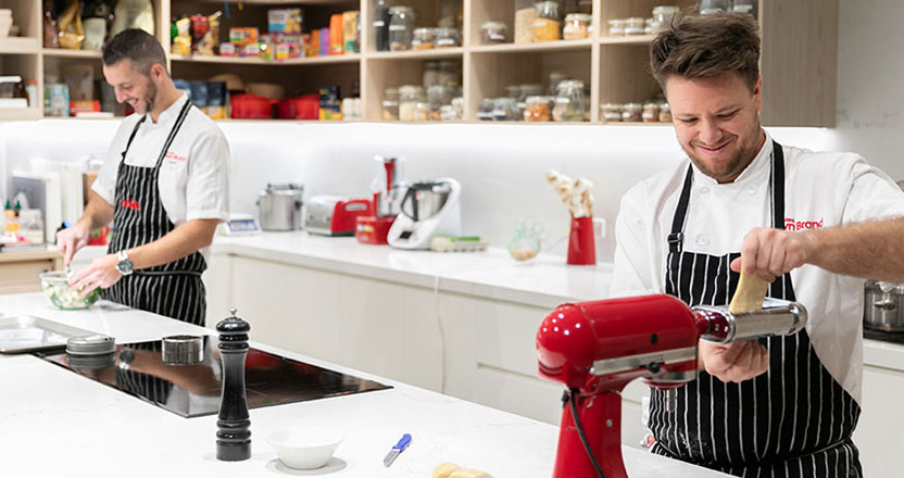 2 chefs in a kitchen