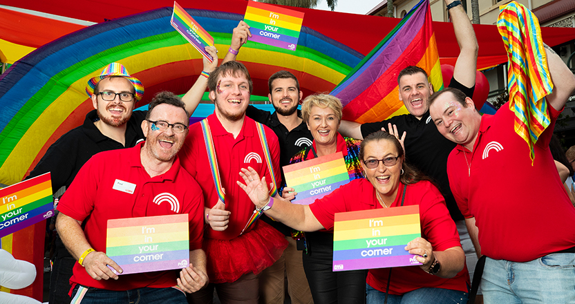 Coles team with pride flags