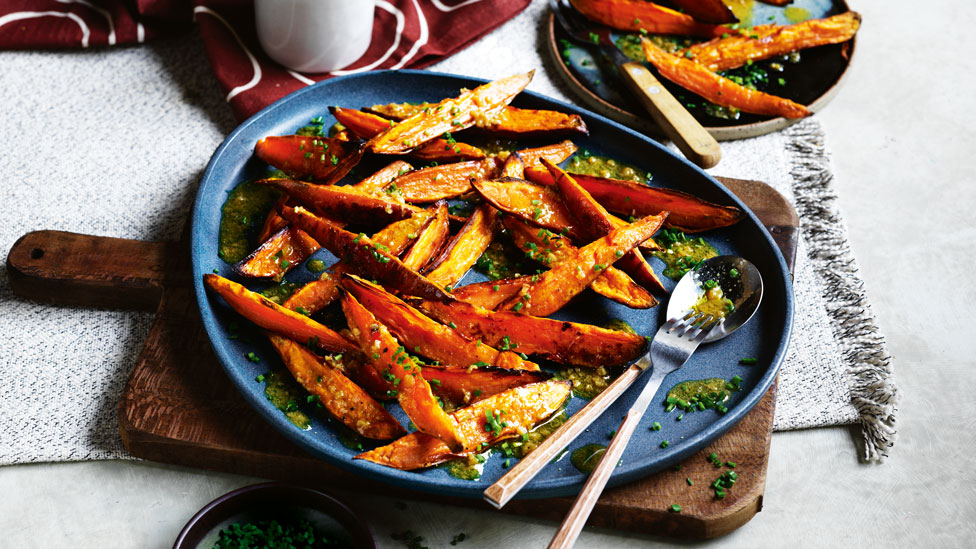 Roasted sweet potato wedges with miso garlic dressing