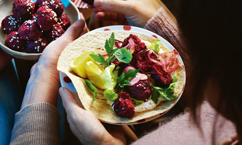 Beetroot falafel wraps with garlic dip.