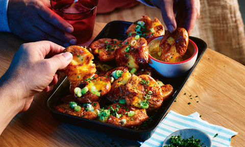 Crispy and golden smashed potatoes with garlic and chives.