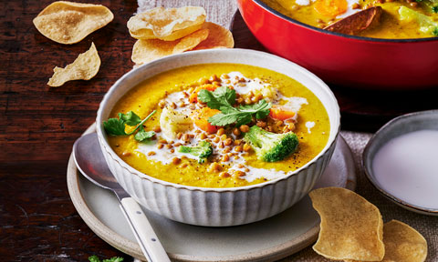 Hearty lentil and vegetable soup with mini pappadums