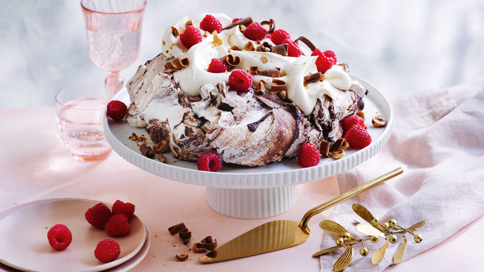Chocolate swirl pavlova with raspberries and cream