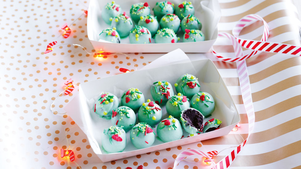 Cookies ’n’ Cream Oreo Truffles balls in light green icing in a white paper box